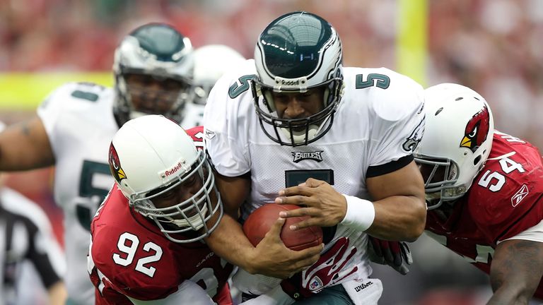 GLENDALE, AZ - JANUARY 18:  Quarterback Donovan McNabb #5 of the Philadelphia Eagles is tackled by defensive end Bertrand Berry #92 and Gerlad Hayes #54 of