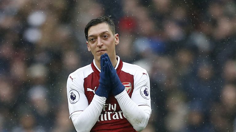 Mesut Ozil reacts during the Premier League match between Tottenham Hotspur and Arsenal at Wembley Stadium