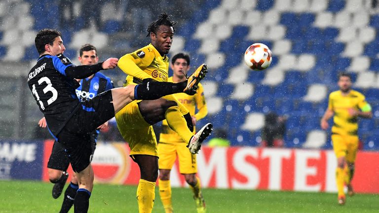 Atalanta's defender from Italy Mattia Caldara (L) fights for the ball with  Borussia Dortmund's forward from Belgium Michy Batshuayi during the round of 32