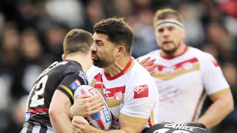 Widnes Matt Whitley and Hep Cahill tackle Catalans Mickael Simon