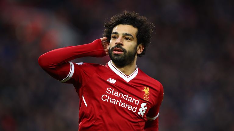 Mohamed Salah of Liverpool celebrates after scoring his sides first goal during the Premier League match between Liverpool