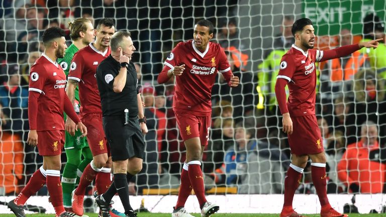 Joel Matip argues with Moss after the awarding of the second Spurs penalty