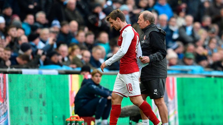 Nacho Monreal leaves the pitch injured during the Carabao Cup final between Manchester City and Arsenal