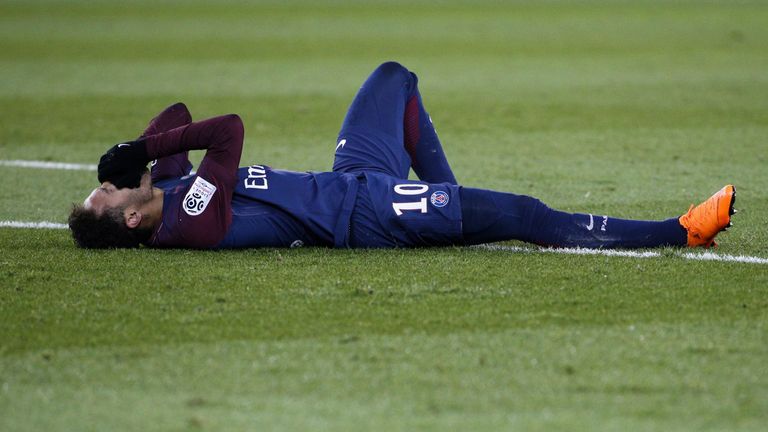 Paris Saint-Germain's Brazilian forward Neymar Jr reacts lying on the pitch during the French L1 football match between Paris Saint-Germain (PSG) and Marse