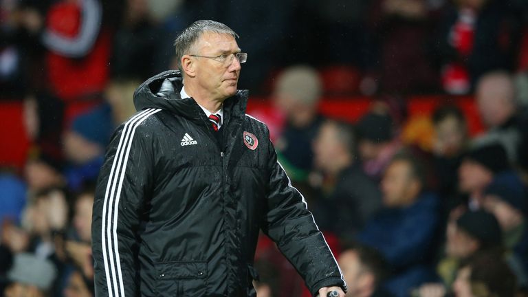 MANCHESTER, ENGLAND - JANUARY 09:  Nigel Adkins, the manager of Sheffield United walks in at half time during the Emirates FA Cup Third Round match between