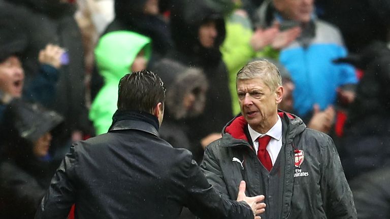 Mauricio Pochettino and Arsene Wenger shake hands after the North London derby