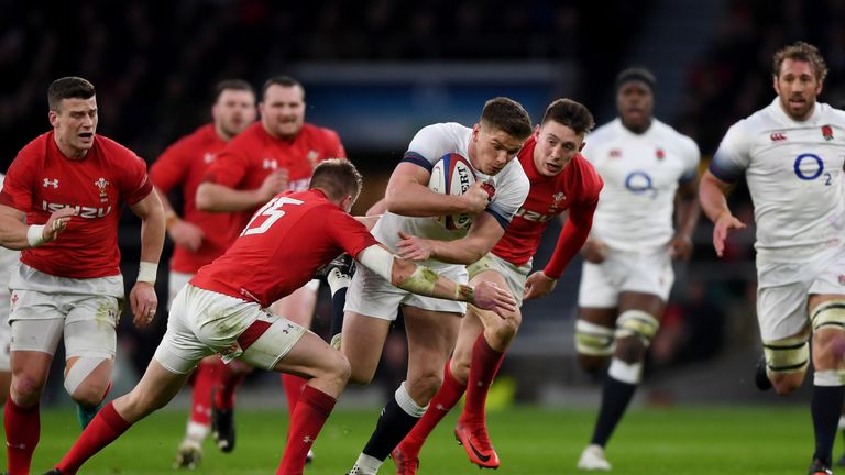 Owen Farrell of England is tackled by Gareth Anscombe of Wales during the Six Nations round two match between England and Wales