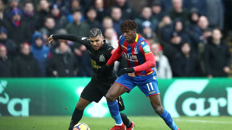 Crystal Palace's Wilfried Zaha (right) and Newcastle United's DeAndre Yedlin battle for the ball