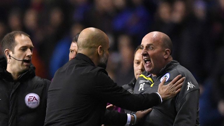 WIGAN, ENGLAND - FEBRUARY 19:  Josep Guardiola, Manager of Manchester City argues with Paul Cook, Manager of Wigan Athletic during the Emirates FA Cup Fift