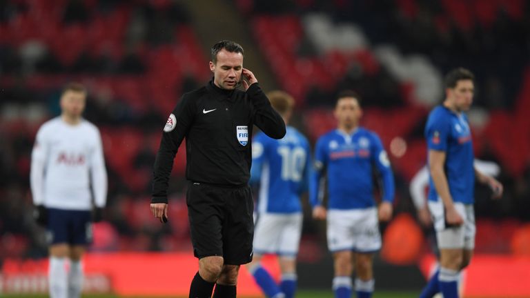 Referee Paul Tierney consults VAR and disallows a goal from Eric Lamela during the FA Cup replay between Tottenham and Rochdale