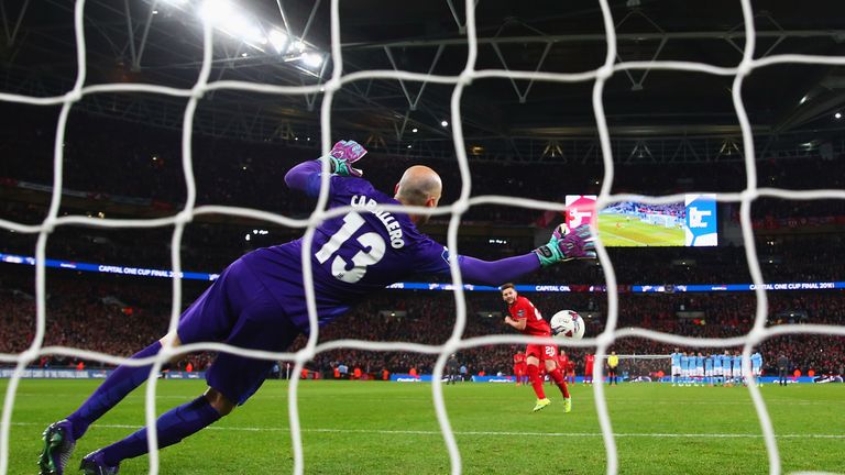 LONDON, ENGLAND - FEBRUARY 28:  Willy Caballero of Manchester City saves a penalty from Adam Lallana of Liverpool in the shoot out during the Capital One C