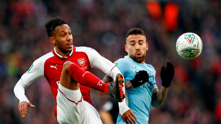 Pierre-Emerick Aubameyang and Nicolas Otamendi in action during the Carabao Cup Final