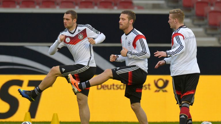 (L-R) Germany's Pierre-Michel Lasogga, defender Shkodran Mustafi and midfielder Andre Hahn take part in a training session of the German national football 