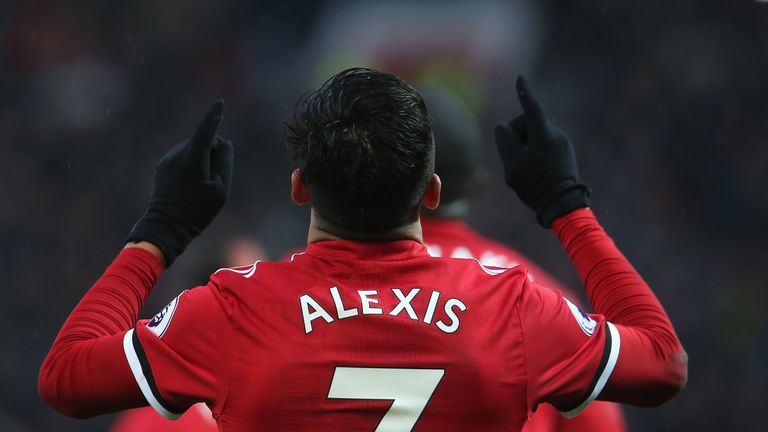 Alexis Sanchez celebrates after scoring from the penalty spot