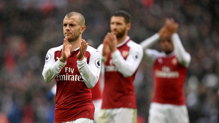 Arsenal players applaud the away fans after the 1-0 defeat to Tottenham