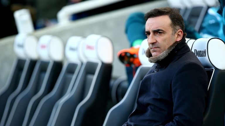 Carlos Carvalhal looks on from the bench prior to the Premier League match between Brighton and Swansea