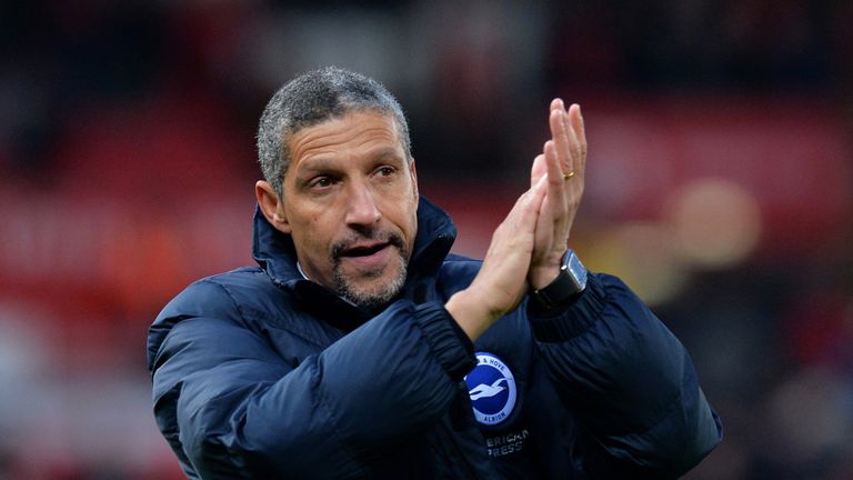 Brighton and Hove Albion manager Chris Hughton applauds the Brighton fans at the final whistle