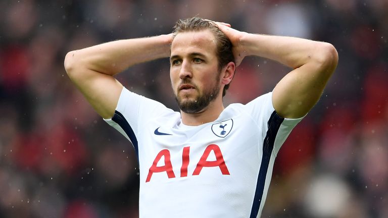 Harry Kane reacts after heading over the bar
