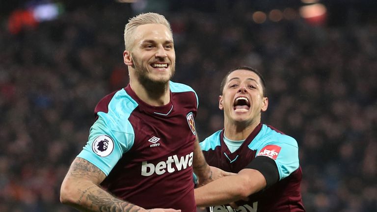 Marko Arnautovic celebrates his goal with team-mate Javier Hernandez