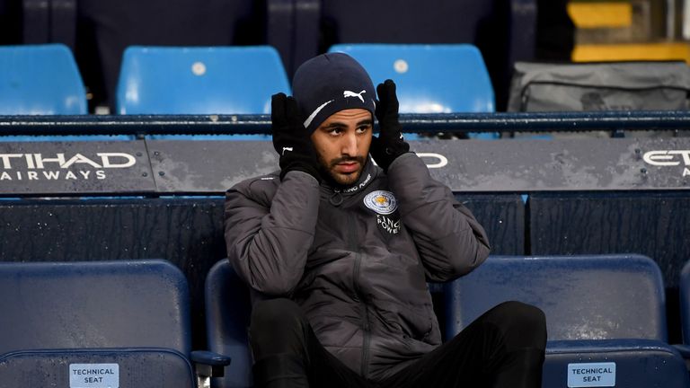 Riyad Mahrez looks on from the Leicester City bench at the Etihad Stadium