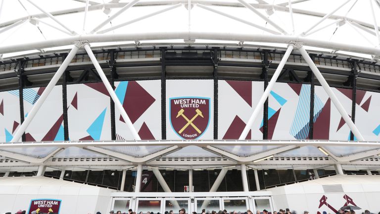 General view outside the London Stadium as fans take shelter from the rain, ahead of the Premier League against Watford