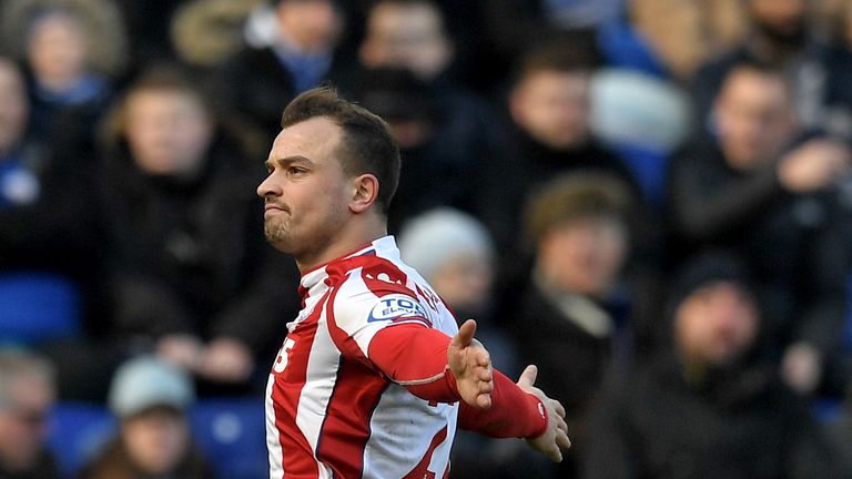 Xherdan Shaqiri celebrates scoring the opening goal during the match between Leicester City and Stoke City