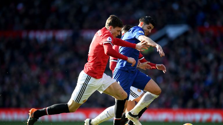 MANCHESTER, ENGLAND - FEBRUARY 25:  Victor Lindelof of Manchester United and Alvaro Morata of Chelsea compete for the ball during the Premier League match 