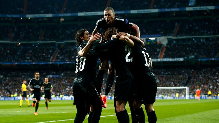 Adrien Rabiot is mobbed by his PSG team-mates after given PSG the lead