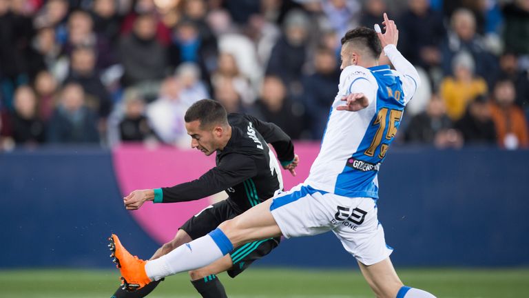 LEGANES, SPAIN - FEBRUARY 21: Lucas Vazquez of Real Madrid shoots past Diego Rico of CD Leganes to score his team's first goal during the La Liga match bet