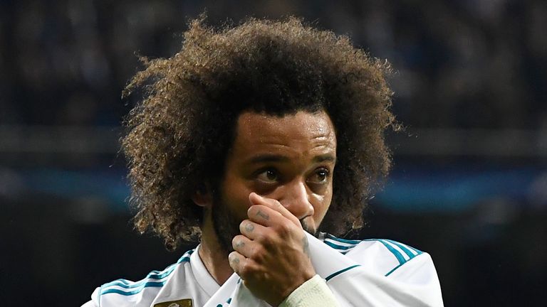 Real Madrid's Brazilian defender Marcelo celebrates  after scoring during the UEFA Champions League round of sixteen first leg football match Real Madrid C