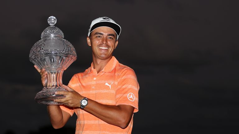 PALM BEACH GARDENS, FL - FEBRUARY 26:  Rickie Fowler of the United States celebrates with the winner's trophy after the final round of The Honda Classic at