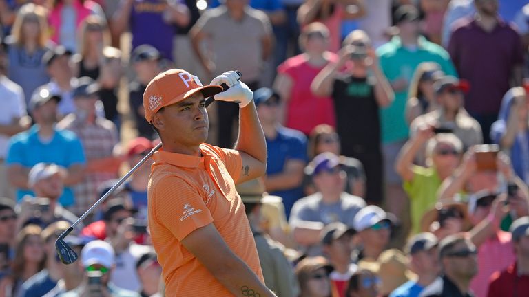 SCOTTSDALE, AZ - FEBRUARY 04:  Rickie Fowler watches his tee shot on the seventh hole during the final round of the Waste Management Phoenix Open at TPC Sc