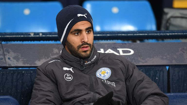 Riyad Mahrez looks on from the Leicester City bench at the Etihad Stadium