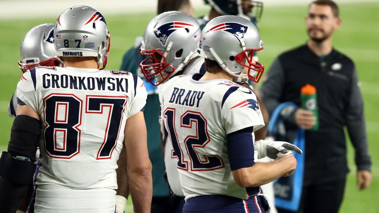MINNEAPOLIS, MN - FEBRUARY 04:  Tom Brady #12 and Rob Gronkowski #87 of the New England Patriots prepare to take the field in the first quarter in Super Bo
