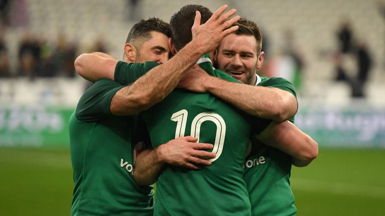 Rob Kearney, Fergus McFadden and Sexton celebrate after securing the victory