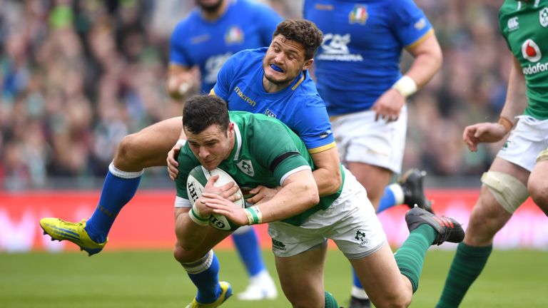 DUBLIN, IRELAND - FEBRUARY 10:  Robbie Henshaw of Ireland is tackled by Marcello Violi of Italy during the NatWest Six Nations match between Ireland and It