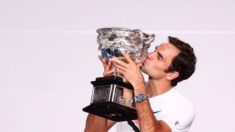 Roger Federer of Switzerland kisses the Norman Brookes Challenge Cup after winning the 2018 Australian Open on January 28, 2018