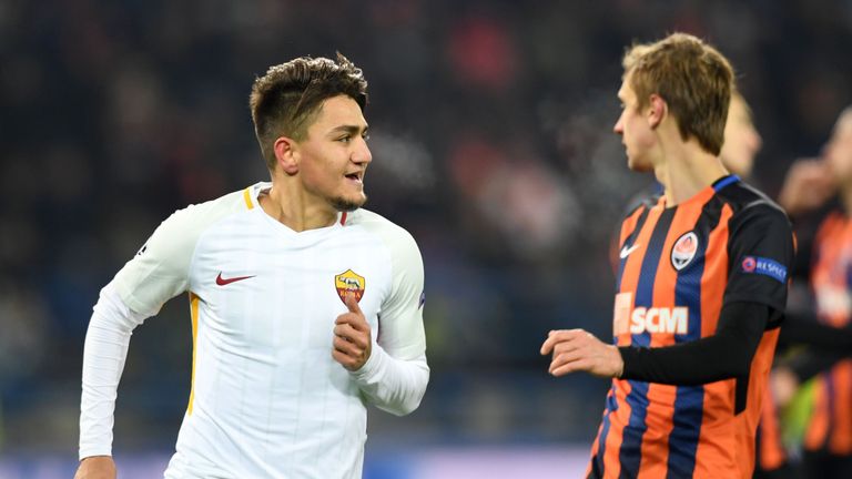 Roma's Turkish midfielder Cengiz Under (L) celebrates scoring a goal against Shakhtar Donetsk during the UEFA Champions League round of 16 first leg footba