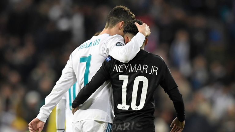 Real Madrid's Portuguese forward Cristiano Ronaldo (L) and Paris Saint-Germain's Brazilian forward Neymar leave the pitch at half-time during the UEFA Cham
