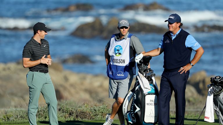 PEBBLE BEACH, CA - FEBRUARY 09:  Rory McIlroy of Northern Ireland (L) and Phil Mickelson meet at the 13th tee during Round Two of the AT&T Pebble Beach Pro