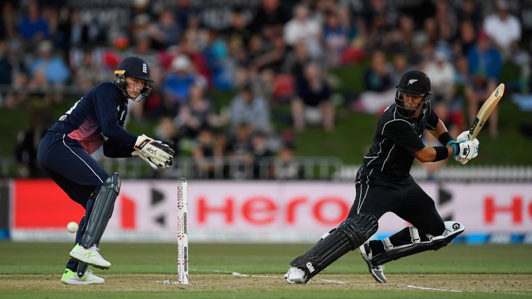 Jos Buttler looks on as New Zealand batsman Ross Taylor picks up some runs during the 1st ODI between New Zealand and England