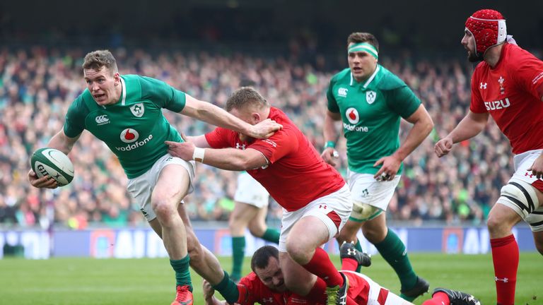 Chris Farrell breaks the tackle of Wales prop Samson Lee