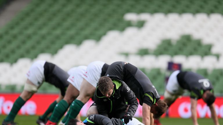 Johnny Sexton receives treatment during the captain's run ahead of Ireland's Six Nations game with Wales