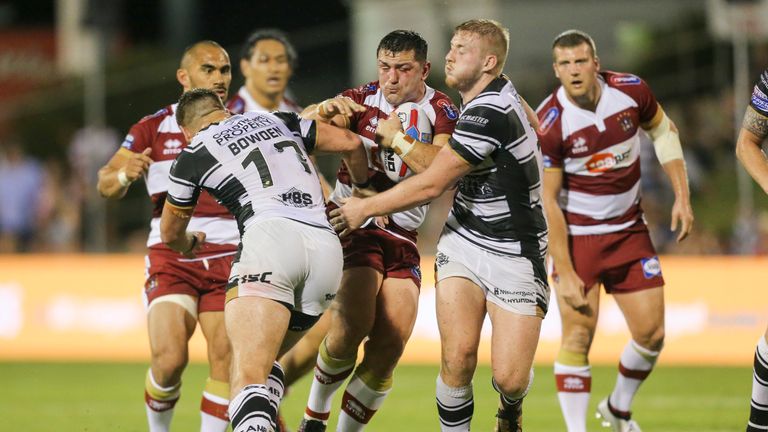Ben Flower is tackled by Hull FC's Josh Bowden and Jordan Abdul