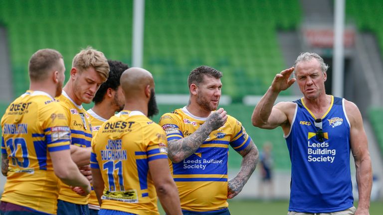 Rhinos head coach Brian McDermott (right) speaks to Brett Delaney