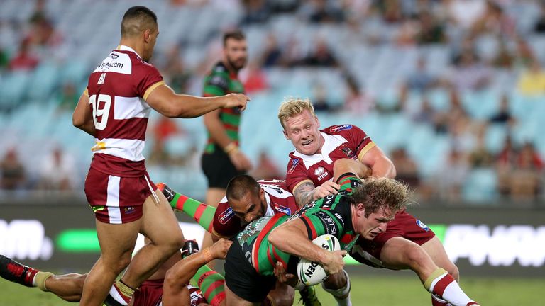 George Burgess is tackled by three Wigan defenders