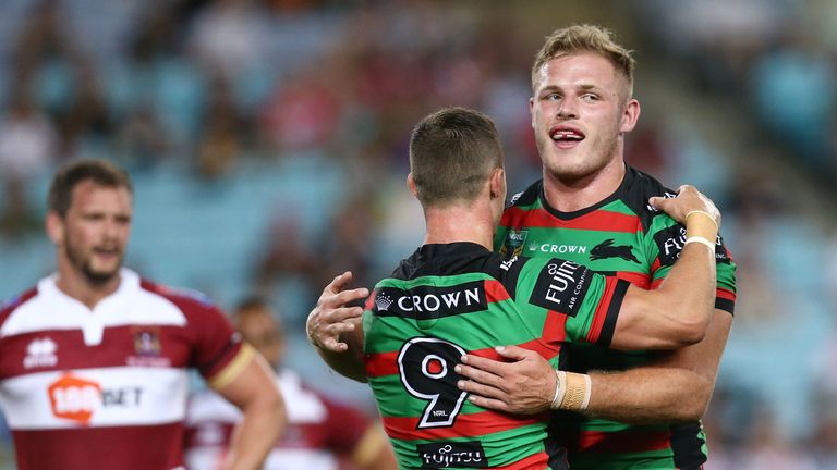 Tom Burgess (right) celebrates with Damien Cook after scoring a try against Wigan