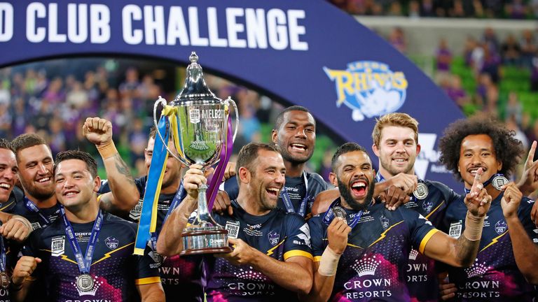Cameron Smith and Melbourne Storm teammates celebrate with the World Club Challenge Cup after defeating Leeds Rhinos 38-4
