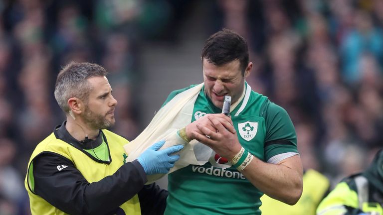 Robbie Henshaw leaves the pitch with a shoulder injury against Italy