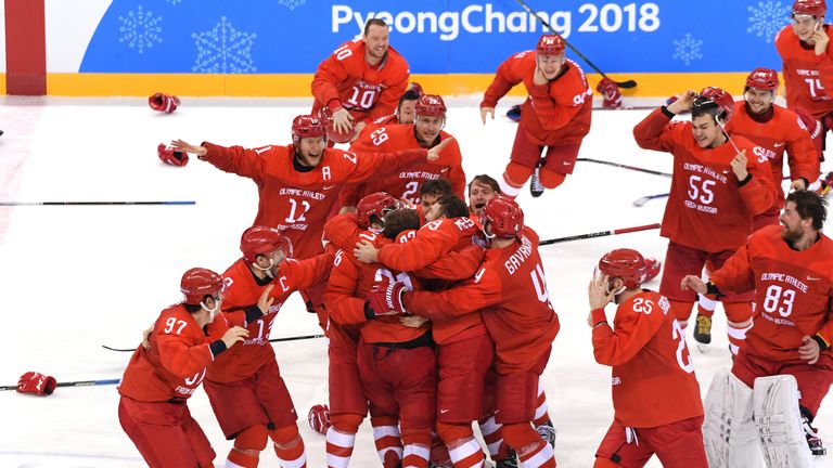 Olympic Athletes from Russia celebrate after defeating Germany 4-3 in the ice hockey final
